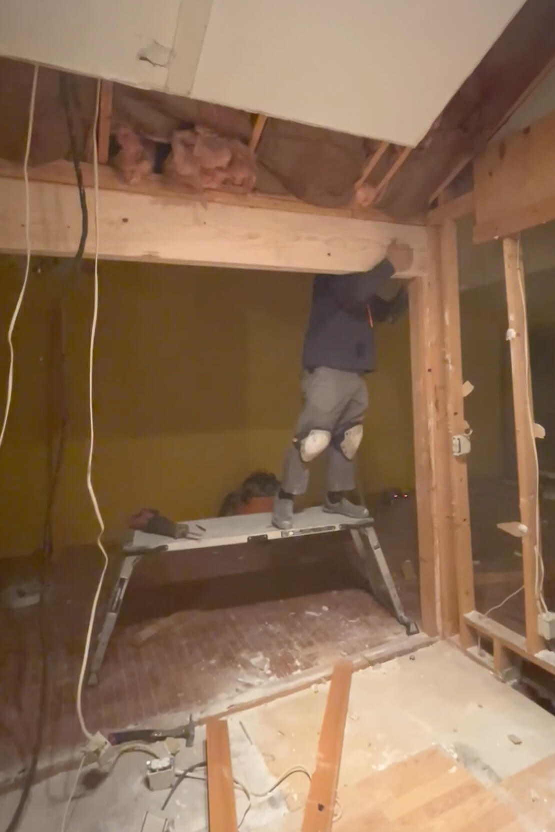 Replacing a load bearing wall with a beam.